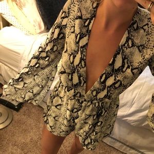 Bell sleeve deep v snakeskin romper